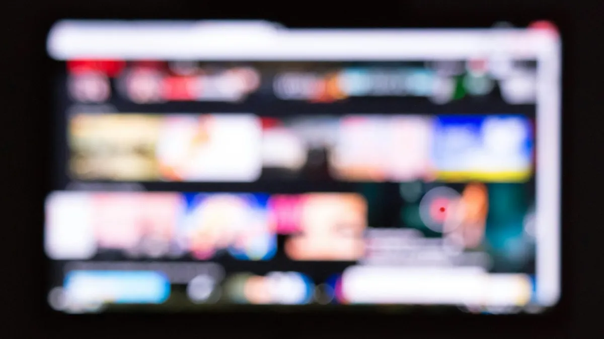 Best devices for IPTV Toronto – remote control in front of a smart TV